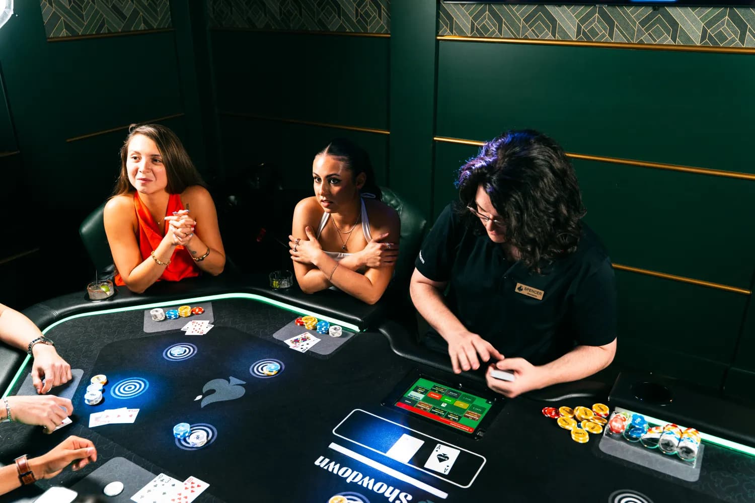 Guests playing social card games around a Showdown table