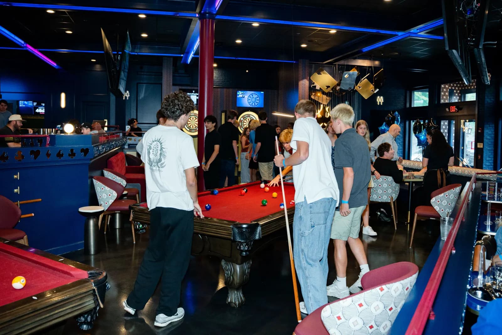 Friends around a game table at Showdown Social