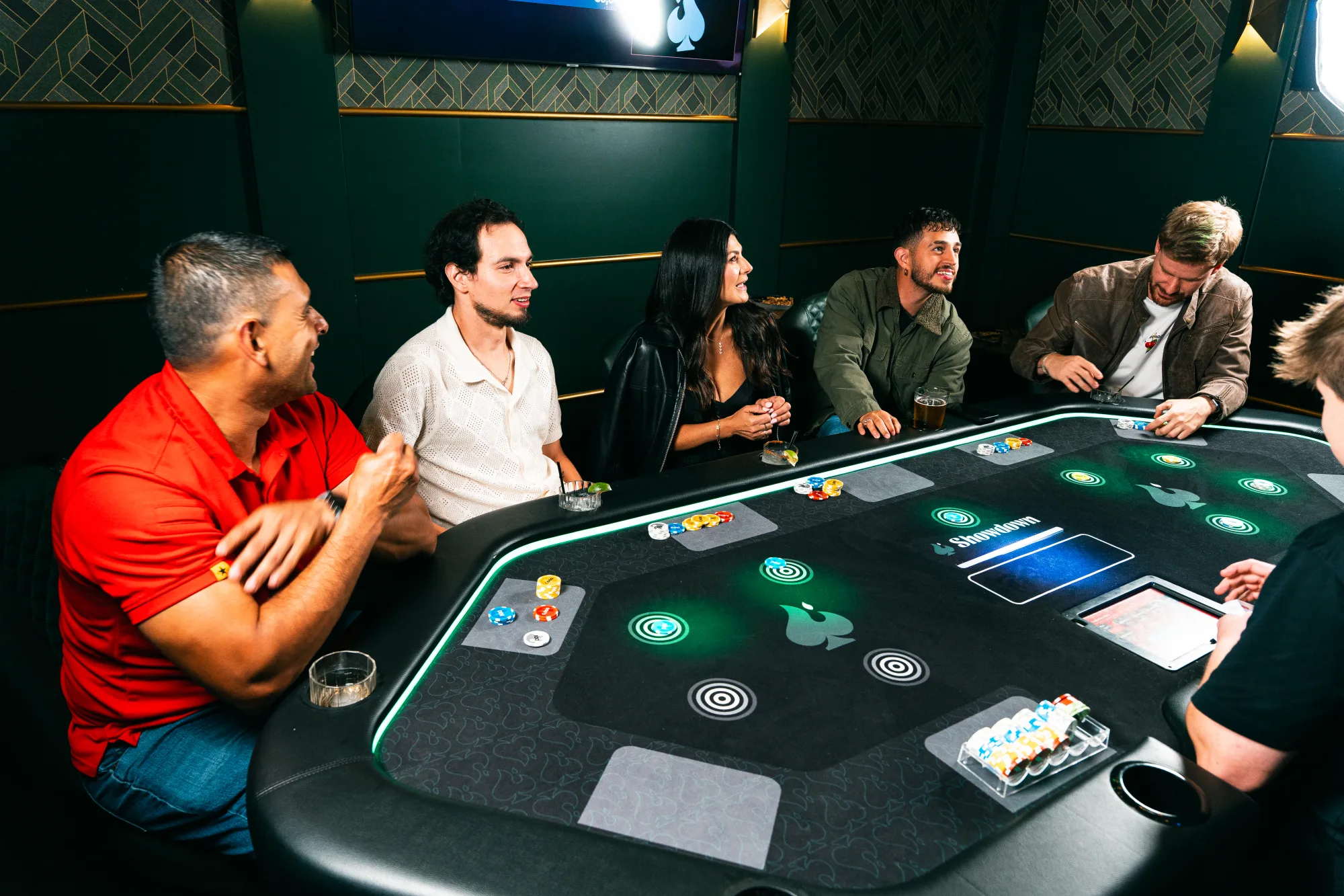 Guests sharing a memorable moment around a Showdown Social card table