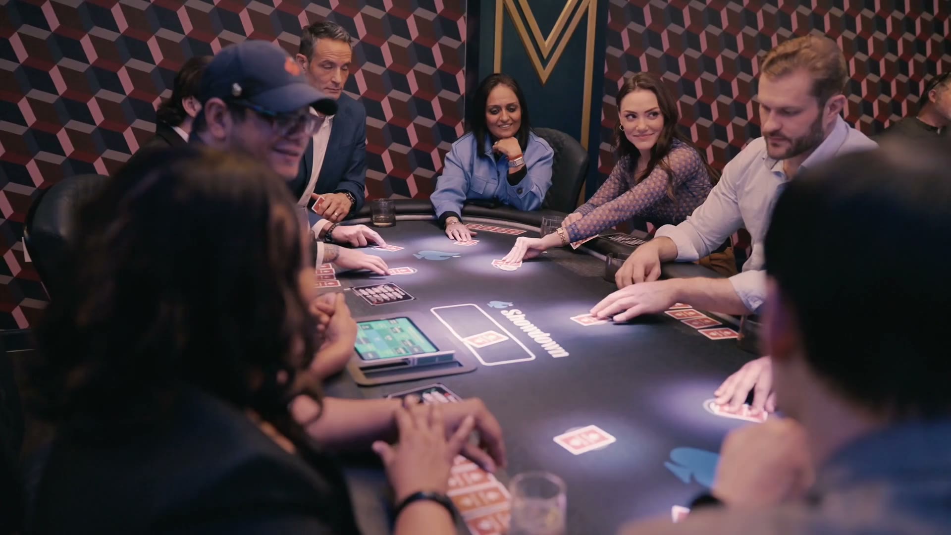 Coworkers gathered around a Showdown card table for a hosted group event